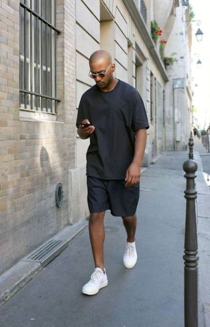 an every day look you can easily repeat   a black t shirt, black Bermuda shorts and white sneakers always works