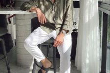 an olive green linen button down, white pants, grey birkenstock sandals and sunglasses are a great combo