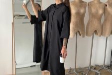 05 a black midi dress with short sleeves, black and grey trainers are a simple and minimal look for summer