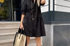 09 a black over the knee shirtdress with short sleeves, a long necklace, black sandals and a neutral tote for summer