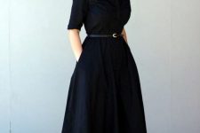 10 a classic black midi shirtdress with an A-line skirt and pockets, short sleeves and ankle strap shoes and a thin belt