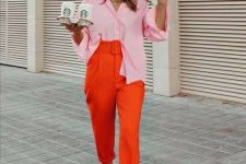 12 a light pink shirt, orange high waisted cropped pants, matching ankle strap shoes for a summer work look