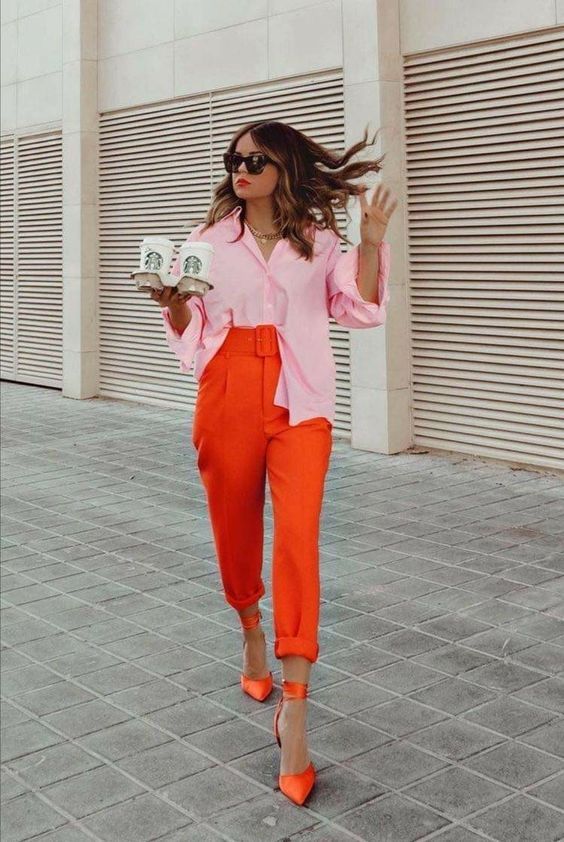 a light pink shirt, orange high waisted cropped pants, matching ankle strap shoes for a summer work look