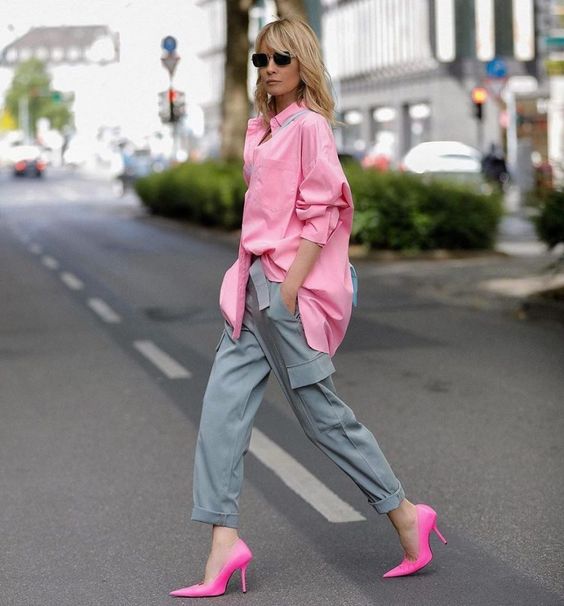 a pink oversized shirt, grey cargo pants, hot pink shoes and a blue bag are all you need for a lovely look