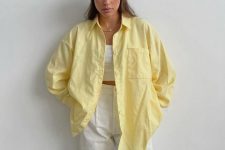 17 a white crop top, white linen trousers and a bold yellow oversized shirt on top that brings color and interest to the look
