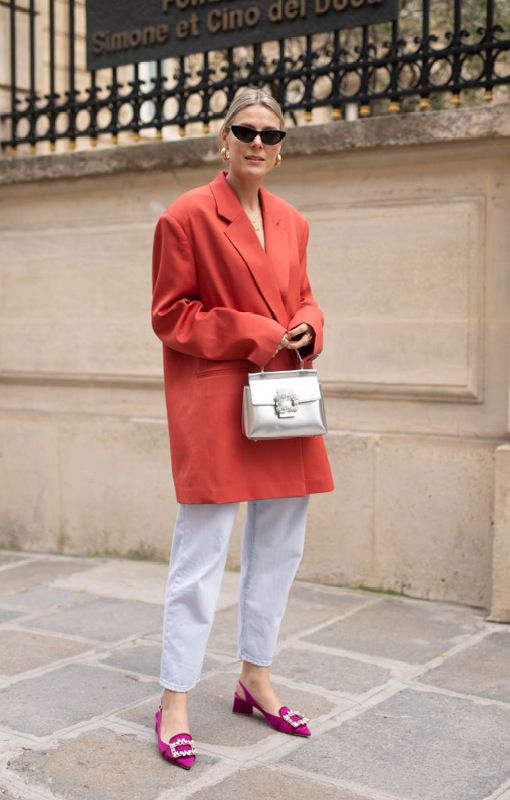 bleached cropped jeans, an oversized red blazer, fuchsia embellished shoes and a silver mini bag