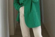 22 white cropped pants, an oversized apple green blazer and two-tone shoes plus a necklace
