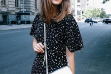 27 a black floral print over the knee dress with short sleeves and a silver handbag are a cool combo for summer