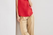 With beige trousers and white leather flat sandals