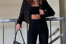 With black flare jeans and black leather bag