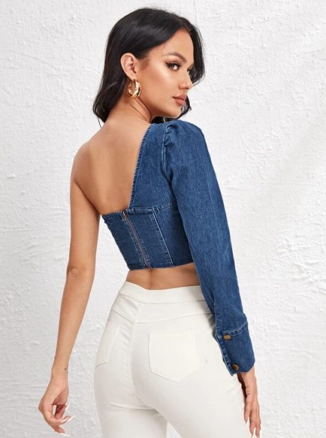 With golden earrings and white high-waisted skinny pants