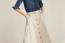 With navy blue denim button down shirt and cream low heeled shoes