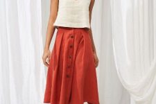 With red button front midi skirt and beige leather platform sandals
