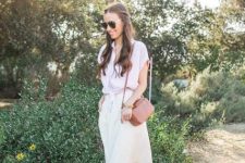 With sunglasses, brown leather bag, beige midi skirt and pale pink leather flat shoes