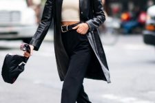 With sunglasses, navy blue flare jeans, black leather belt, black bag and black leather shoes