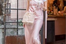 With sunglasses, white t-shirt, pale pink leather crossbody bag and beige lace up flat shoes