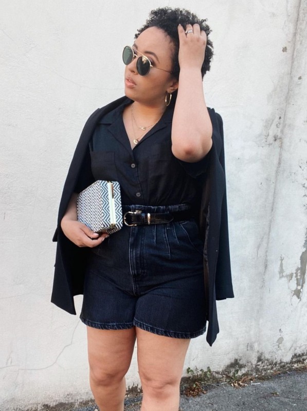 a black linen shirt with pockets, black denim high waisted shorts, black blazer, a printed clutch and chic jewelry