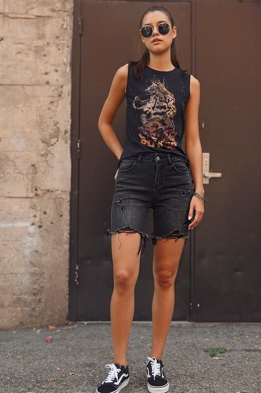a black summer look with a printed top, ripped black denim shorts, black sneakers is a lovely outfit with a rock feel