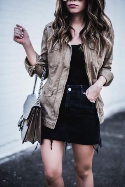 a black top, a black denim mini, a neutral denim jacket and a tan bag are a simple and monochromatic combo for summer