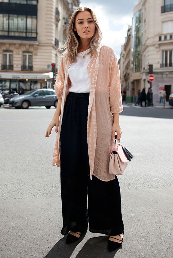 a chic summer outfit with a white sleeveless top, black wide leg pants, black lace up shoes and a pink kimono plus a pink bag