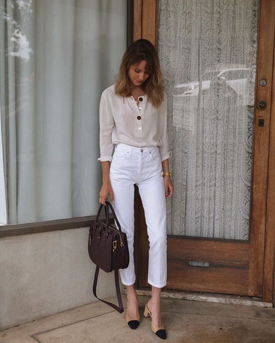 a neutral button down shirt, white cropped jeans, two tone shoes and a burgundy bag for a summer work look