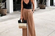 a relaxed summer outfit with a black button up bodysuit, beige linen wide leg pants and a three-tone bag