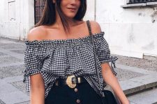 a romantic outfit with a black buffalo check off the shoulder top, a black button up denim mini, a statement belt and a black bag