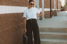 a simple summer look with a white t-shirt, black wide leg pants, neutral shoes and a black woven bag