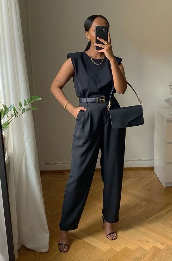 a super elegant black work look for summer with a top with accented shoulder, wideleg pants, black heels, a small bag and a statement chain necklace
