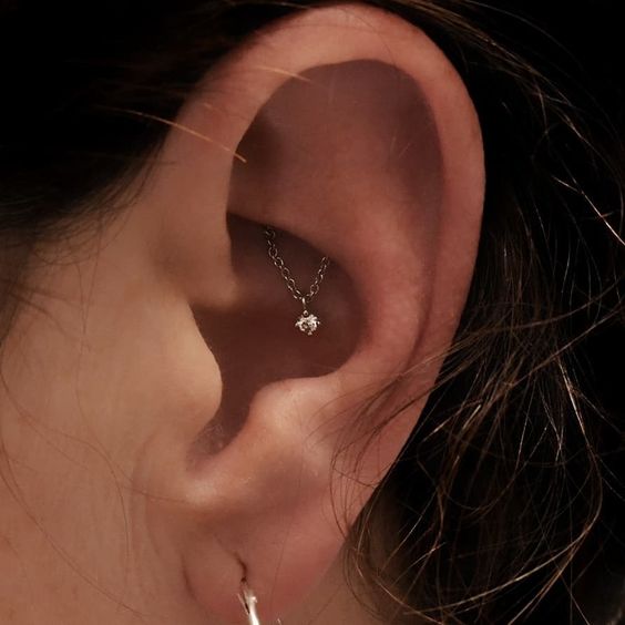a super simple yet bold ear look with a hidden rook piercing and a lobe one is amazing for anyone and is worth trying