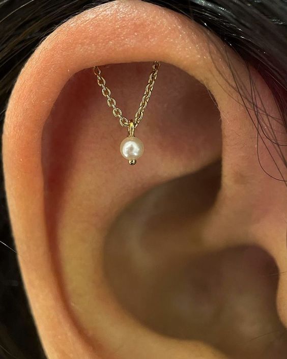 a unique gold chain with a pearl is a fantastic solution for your helix or rook and it will look gorgeous adding a soft touch