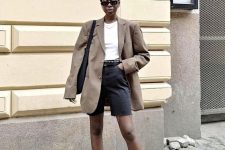 a white t-shirt, black denim shorts, black shoes, a taupe oversized blazer, a black bag for a lovely summer work look
