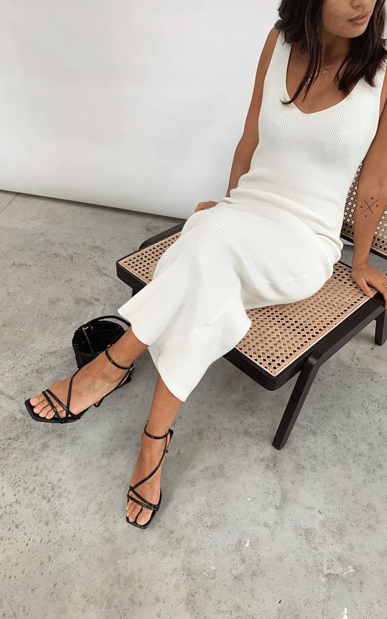an elegant minimalist look with a creamy tank midi dress, a black bucket bag and black strappy heels