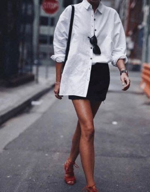 an oversized white shirt, a black denim mini, red lace up heels and a black bag for a gorgeous summer look
