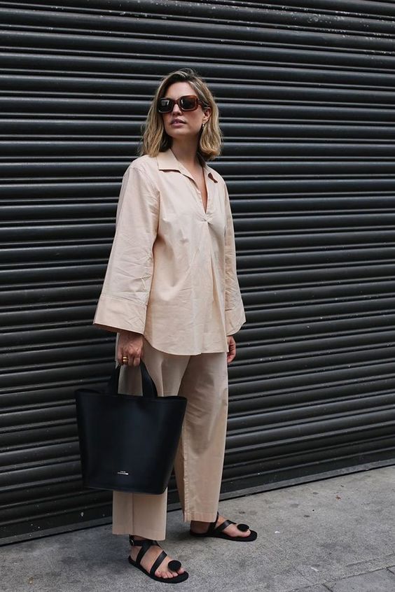 a minimalist look for a hot day - a tan co-ord set of linen, black whimsy shoes and a black tote for summer