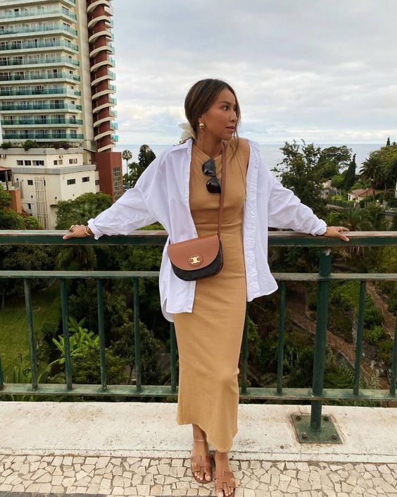 a vacation outfit with a yellow maxi dress, an oversized white shirt, a two tone bag and brown slides