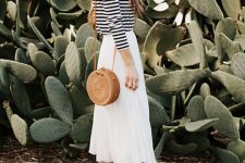 15 a striped long sleeve t-shirt, a white midi skirt, beige sneakers and a round rattan bag for a summer vacation look