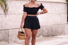 17 a sexy vacation look with a black co-ord set, an off the shoulder crop top, cropped shorts, black spiked sandals and a box bag