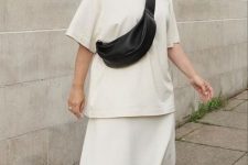 17 an all-minimalist outfit with a creamy t-shirt, a matching maxi skirt, black sandals and a black waistbag