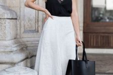 19 a chic minimalist summer look with a white spaghetti strap black top, white culottes, elegant black slippers and a black tote