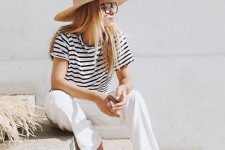 20 a black and white stripe t-shirt, white pants, minimalist flipflops, a wide brim straw hat and glasses