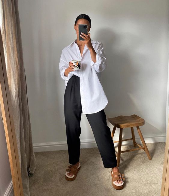 a comfy everyday look with an oversized white shirt, black pants, taupe platform birkenstocks is super cool