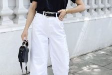 21 a contrasting minimalist outfit with a black t-shirt, white cropped jeans, black sandals and a black bag