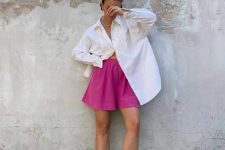 23 a minimalist summer look with an oversized white shirt, fuchsia shorts, black slides is cool for a hot day