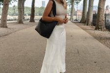 26 a minimalist summer look with a tan tank top, a white slip midi skirt, black sandals and a black tote