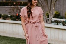 A pale pink short sleeved wrap belted maxi dress