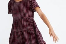 A pink and black checked short sleeved tiered mini dress