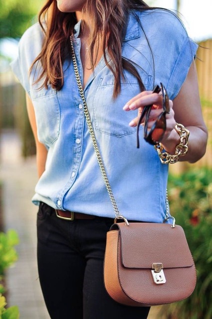 With black skinny jeans, brown leather belt, golden bracelet, sunglasses and pale pink leather chain strap mini bag