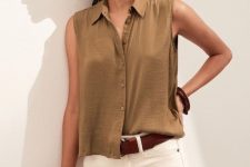 With golden rounded earrings, bracelets, brown leather belt and white denim shorts