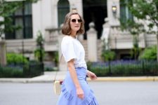 With oversized sunglasses, beige and brown straw bag, white t-shirt and beige ankle strap high heeled shoes